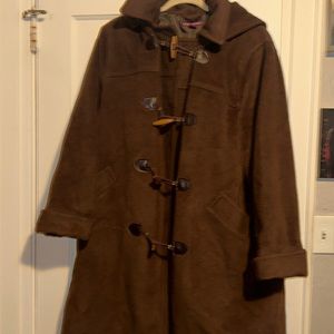 Woman’s long brown winter coat